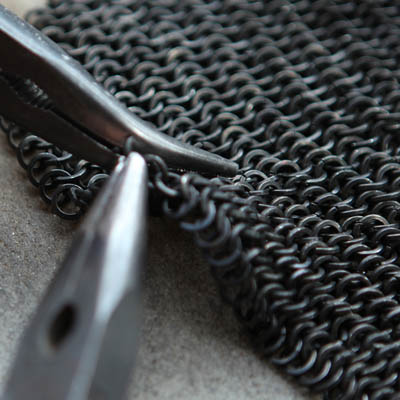 <b>The Black Chainmail</b><br>Chainmail done by hand for a private project. A part of it was used for 'Eldsjäl'.